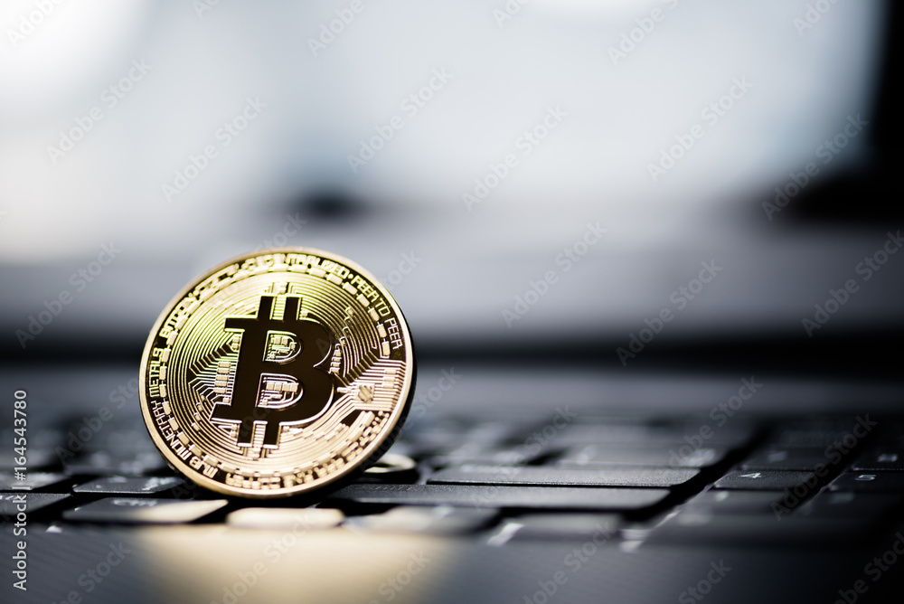 Golden Bitcoin money on computer. Golden Bitcoin money on computer.