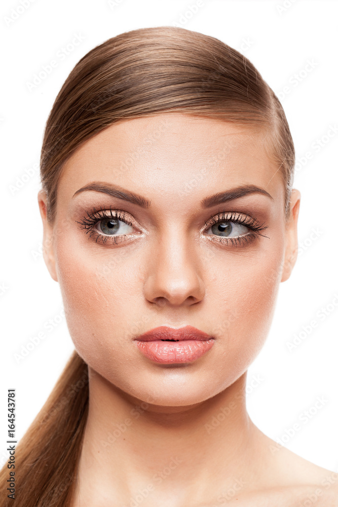 Beautiful model with natural make-up on white background. Studio photo