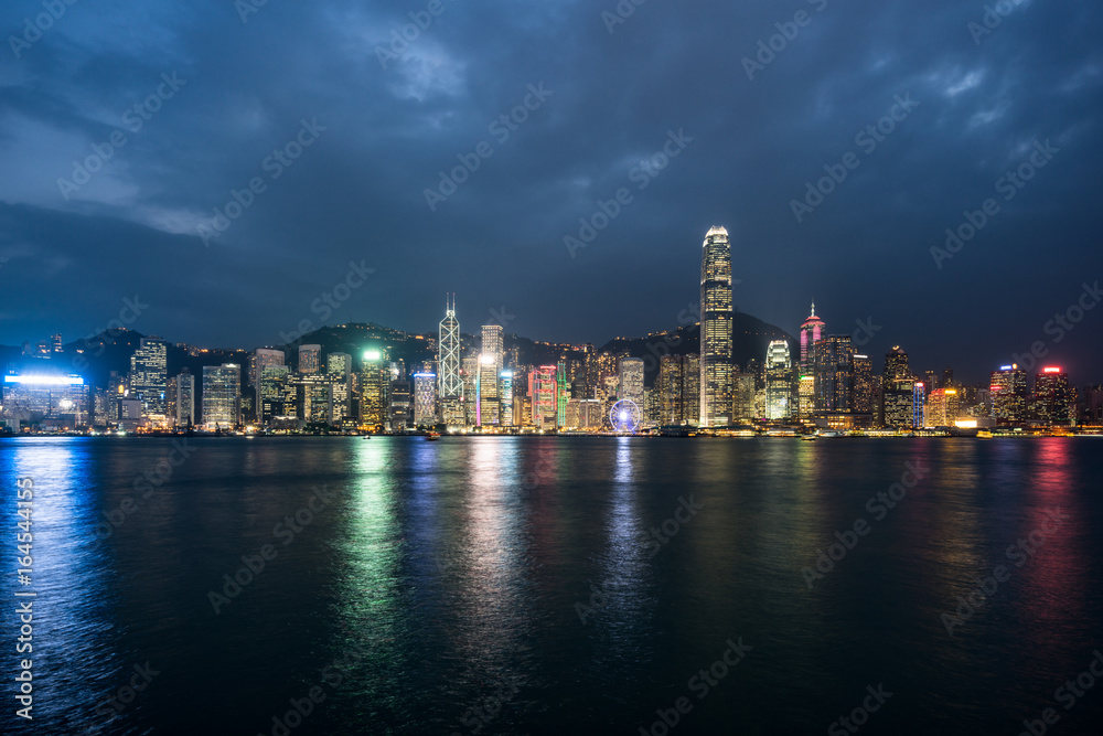 panoramic view of victoria harbor in Hong Kong at night