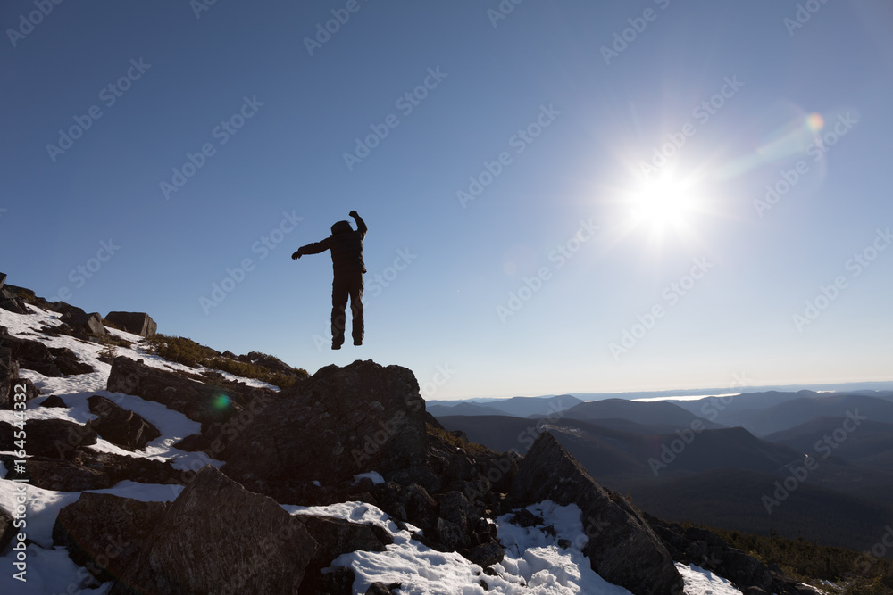 Victorious Man Enjoying the Success of the Richardson Mountain's Summit