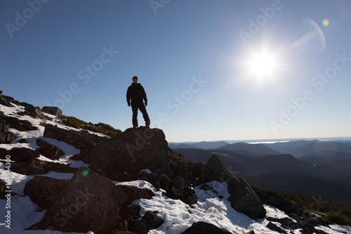 Victorious Man Enjoying the Success of the Richardson Mountain s Summit
