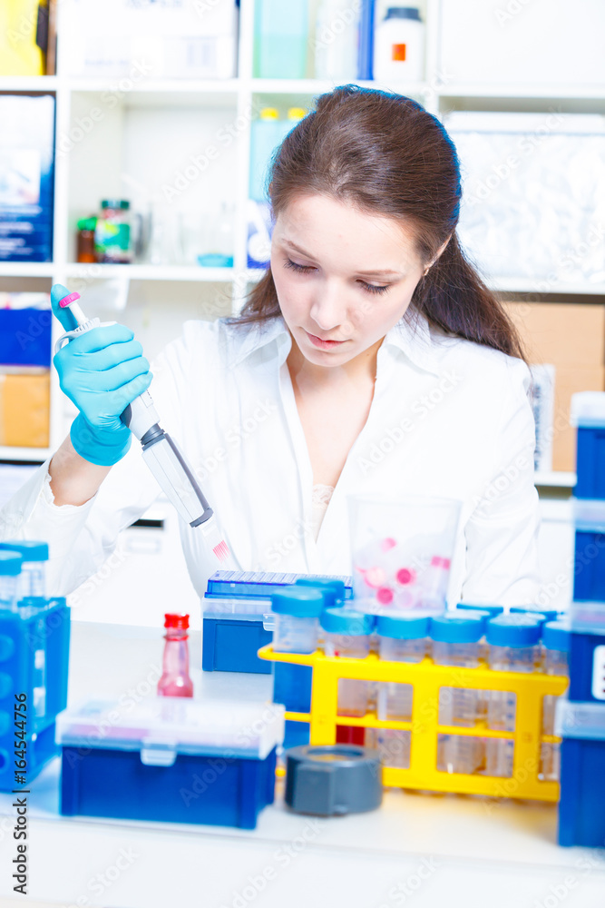 Female technician doing science experiment Female technician doing science experiment