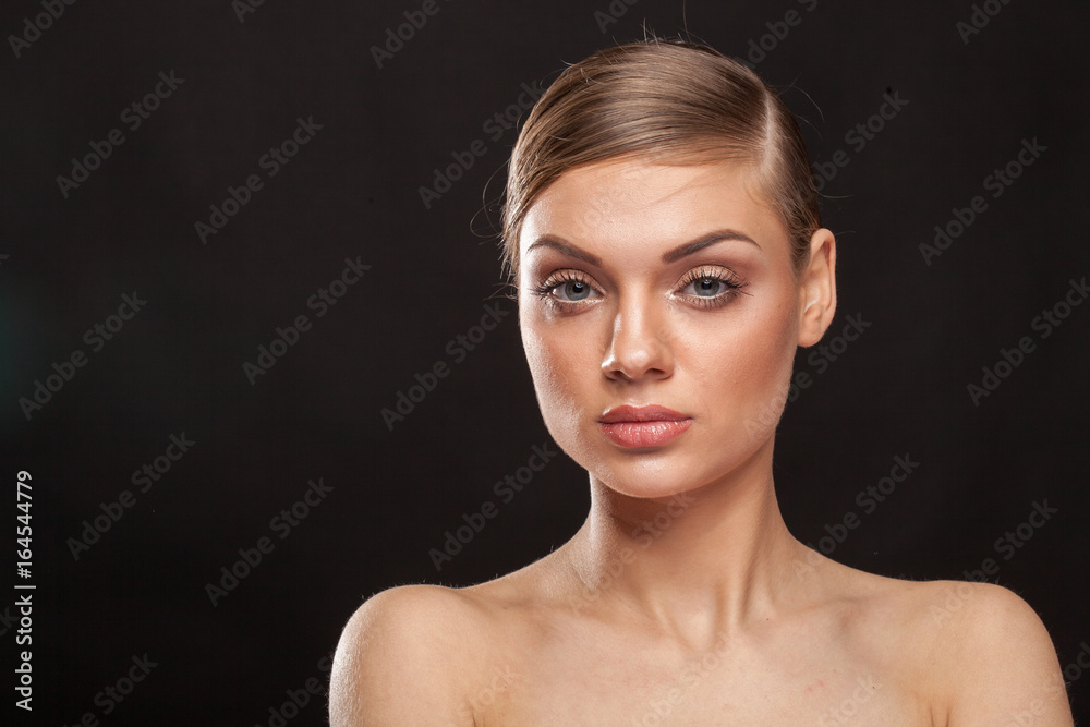 Portrait of beautiful woman with natural make up on black background Portrait of beautiful woman with natural make up on black background