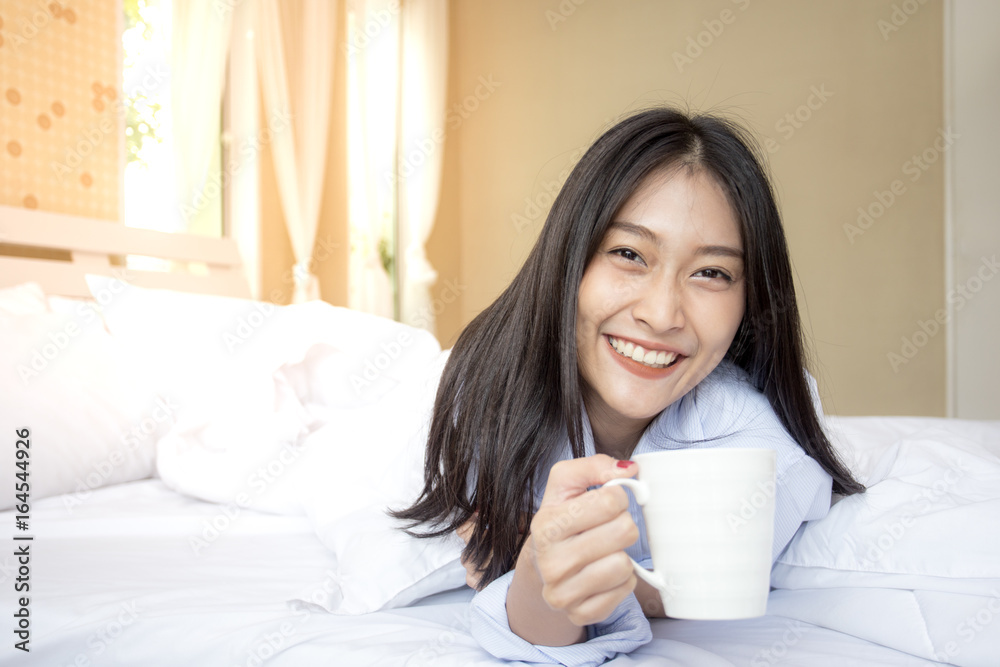 Happy young asian woman hold coffee cup with attractive smiling, 20-25 years old. Happy young asian woman hold coffee cup with attractive smiling, 20-25 years old.