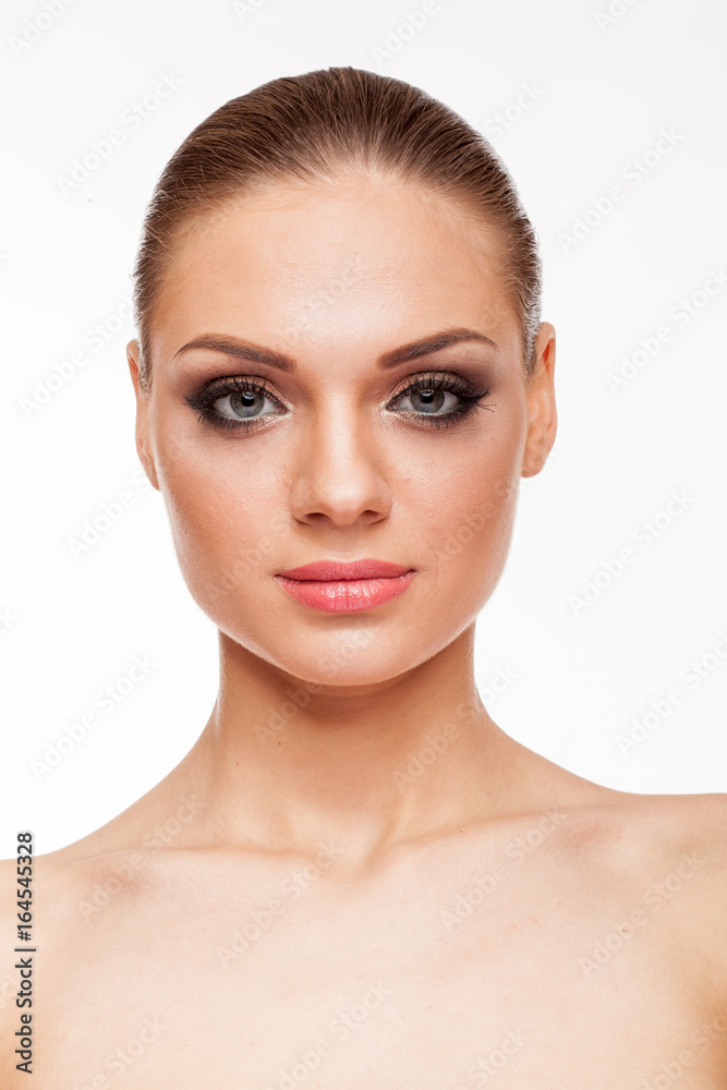 Blonde model with professional make up on white background