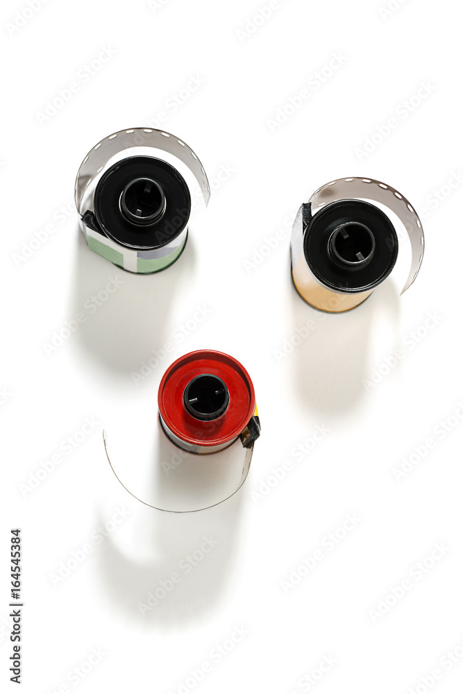 Rolls of dia positive films isolated on white background. Rolls of dia positive films isolated on white background.