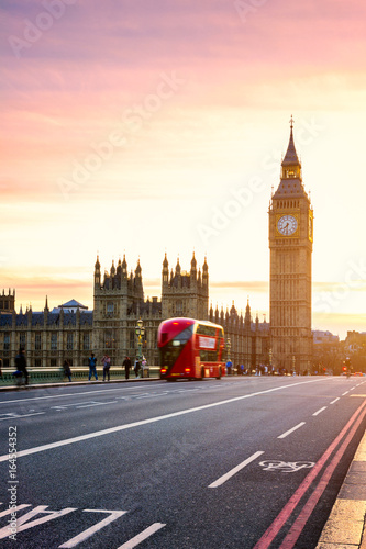 The Big Ben, House of Parliament and double-decker bus blurred in motion, London, UK