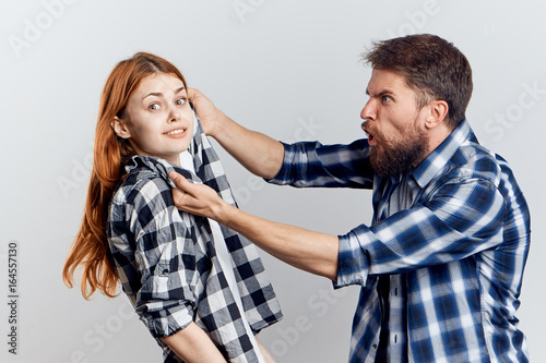 Young guy with beard and beautiful woman on white isolated background, repair, housework