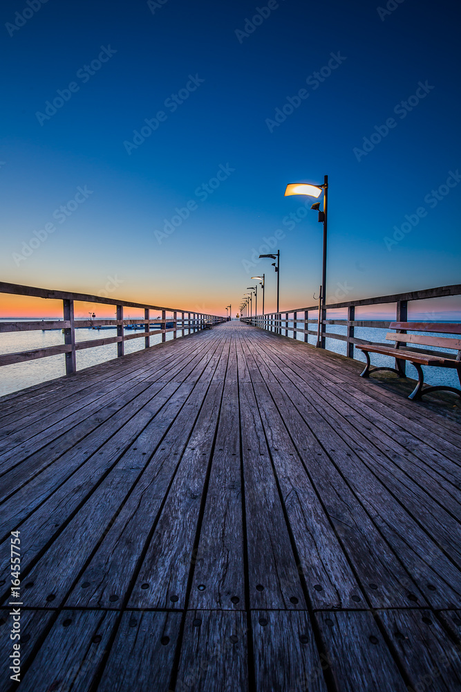 Amazing sunrise on the pier at the seaside. Gdynia Orlowo, Poland Amazing sunrise on the pier at the seaside. Gdynia Orlowo, Poland