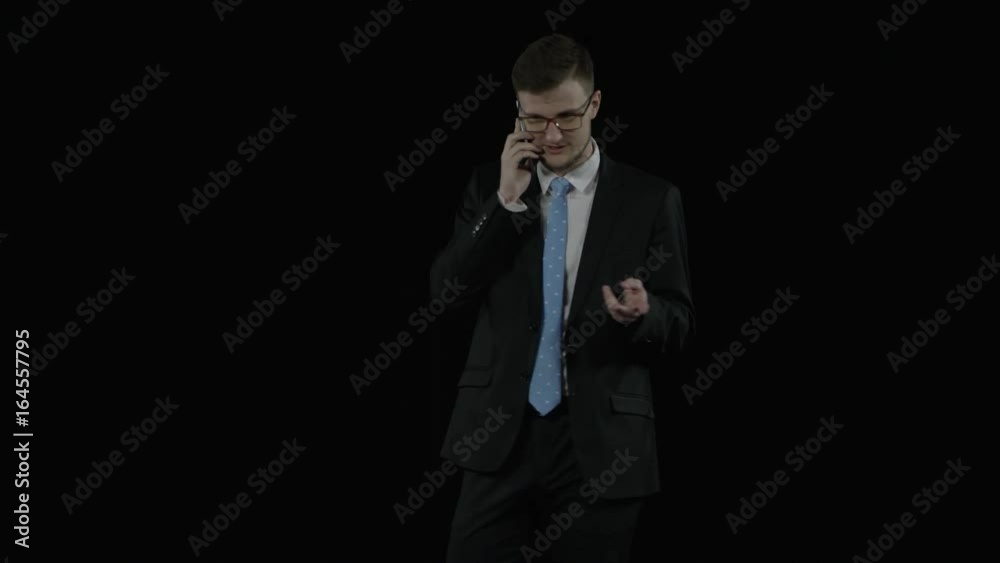 Corporate young man has a phone conversation