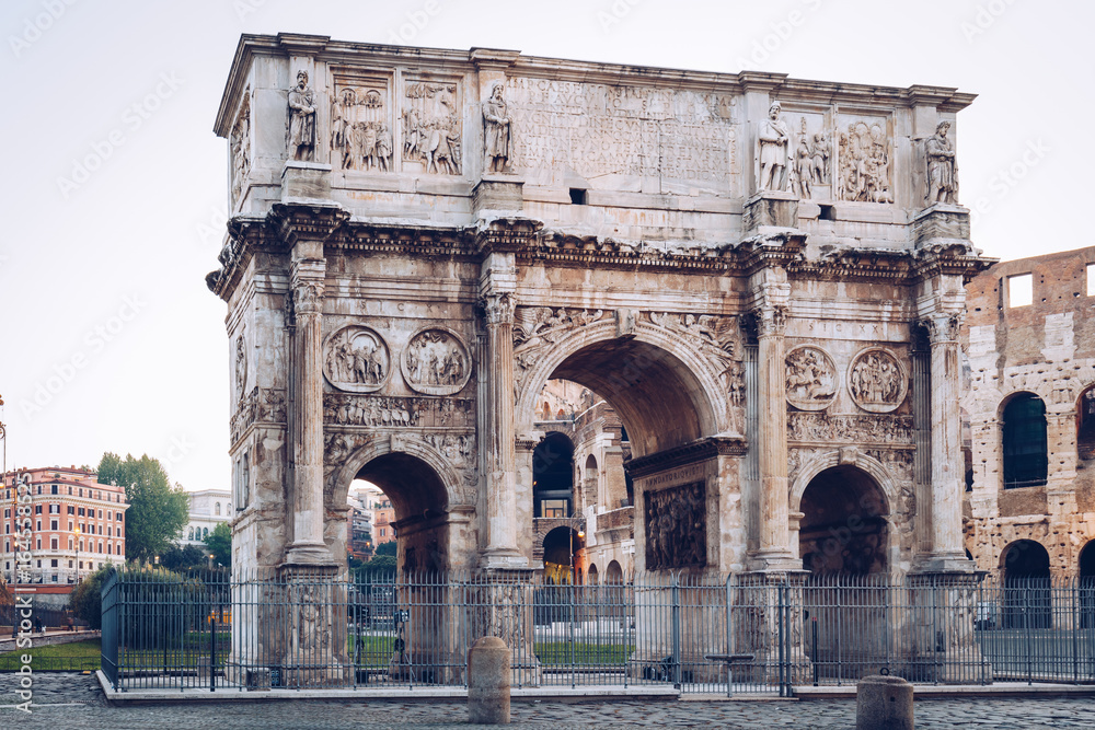 Arch of Constantine and coliseum in background at Rome, Italy Arch of Constantine and coliseum in background at Rome, Italy