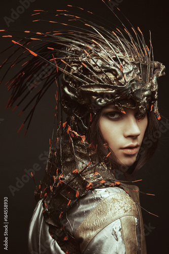 Woman in creative head wear with spikes