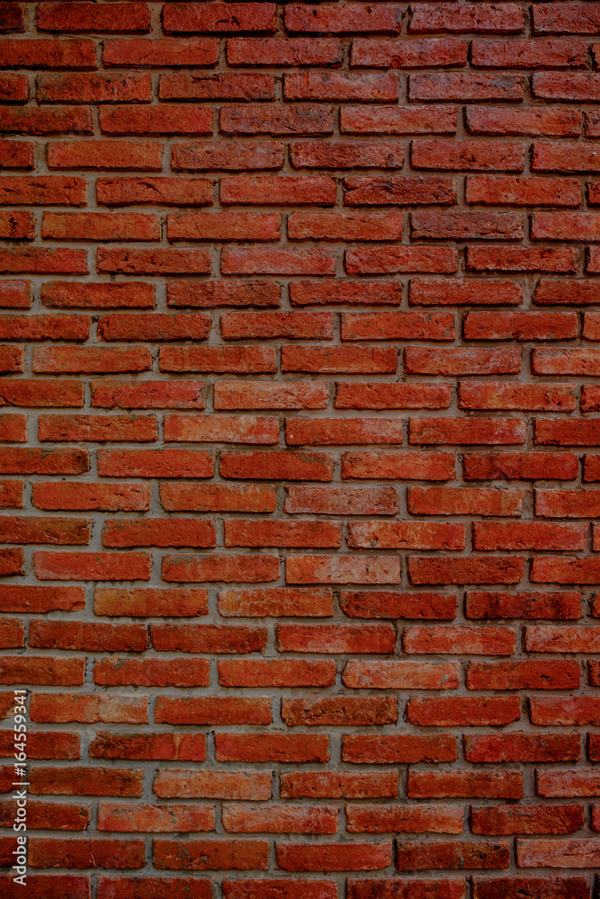 Obraz premium Close up image and vintage style on old brick wall, old texture of red stone blocks
