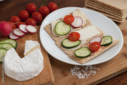 Whole grain healthy crunchy cereal bread with cheese and vegetables