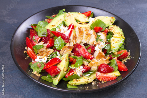 Strawberry, avocado, spinach salad with chicken