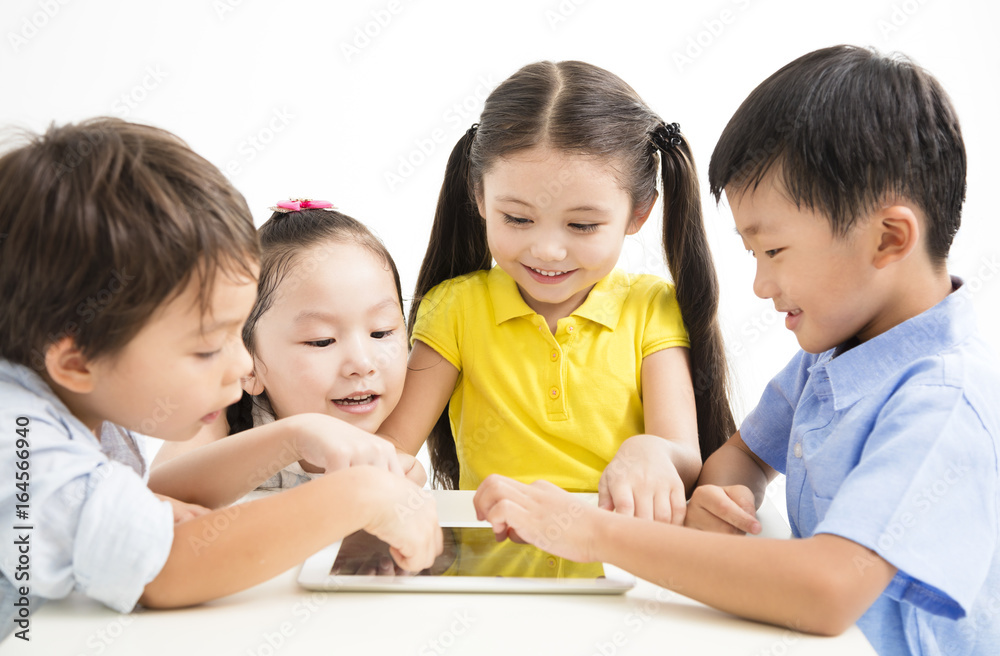 group of school kids studying with tablet group of school kids studying with tablet