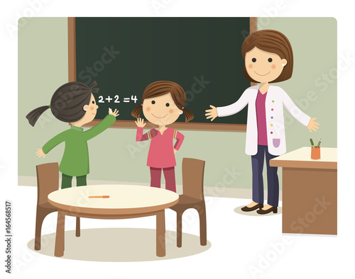 Girls writing on the Board of the College with their teacher