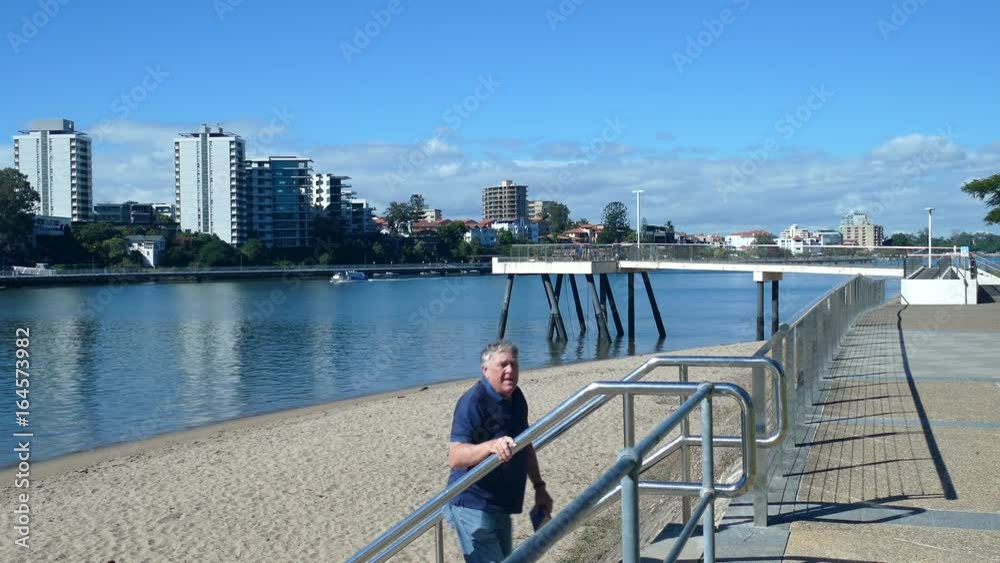 A middle aged male tourist sightseeing in Brisbane which is the capital of Queensland Australia.
A middle aged male tourist sightseeing in Brisbane which is the capital of Queensland Australia.