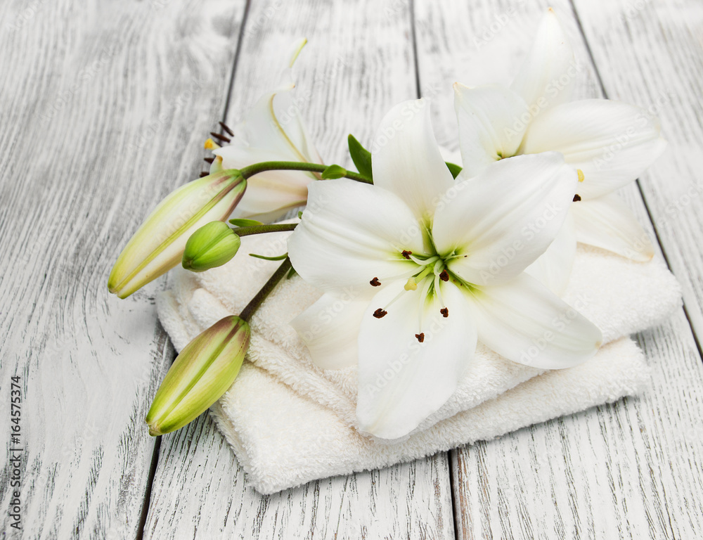 Bath towels and white lilies
