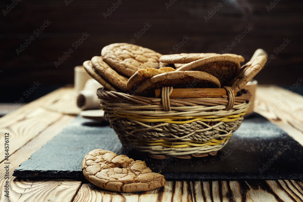 Biscuit sweet cookie background. Domestic stacked butter biscuit pattern concept,close up macro.Homemade cookies on wooden table.Cereal biscuits with the sesame,peanuts,sunflower and amaranth.