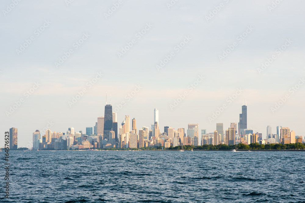 Hazy view of the Chicago skyline with Lake Michigan in the foreground