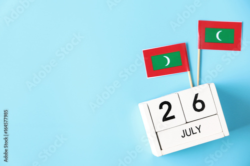 July 26 Wooden calendar Concept independence day of Maldives and Maldives national day.Copy space,minimal style
