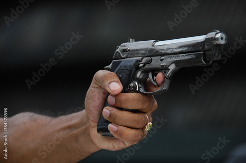 Male Hand with Gun