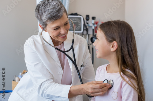 Doctor examining girl