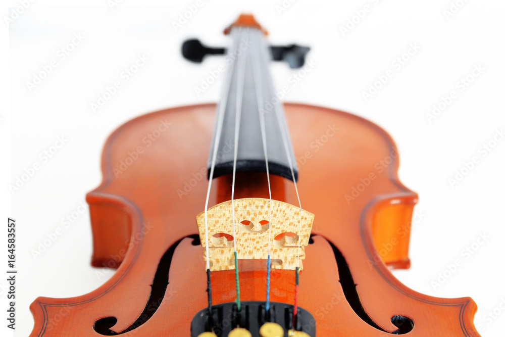 Classical violin from vanishing perspective against a white background. Empty copy space for Editor's text. Classical violin from vanishing perspective against a white background. Empty copy space for Editor's text.