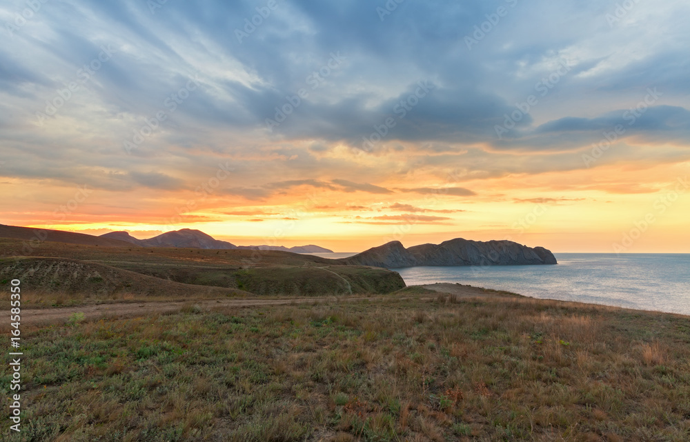 The sunrise over the mountains Cape and the sea. Journey to the Crimea Peninsula, Cape Chameleon