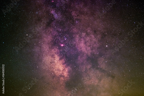 Fototapeta Naklejka Na Ścianę i Meble -  The Galactic Center with the Lagoon Nebula, the Trifid Nebula, the Omega Nebula, and the planet Saturn as seen from Radolfzell in Germany.