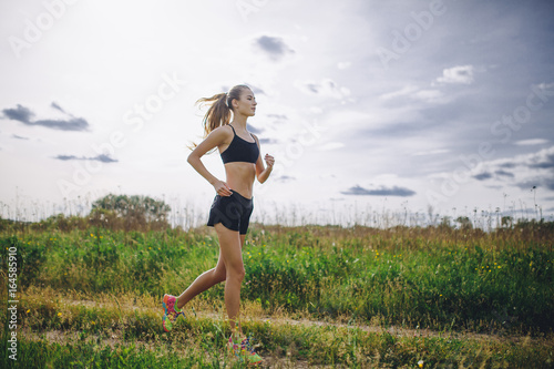 A young girl jogging outdoor