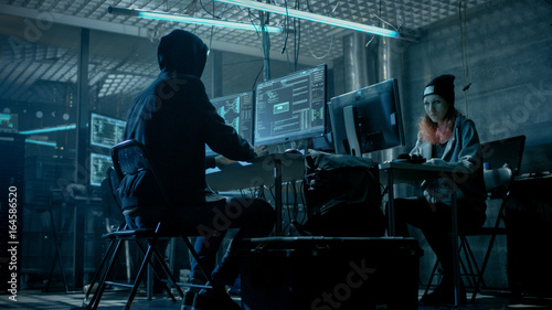 Group of Teenage Hackers Organize Attack on Corporate Data Servers. Their Lair is Dark and Full of Operating Displays.