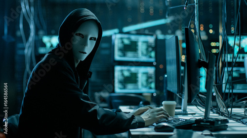 Canvastavla Masked Hacker is Using Computer for Organizing Massive Data Breach Attack on Corporate Servers