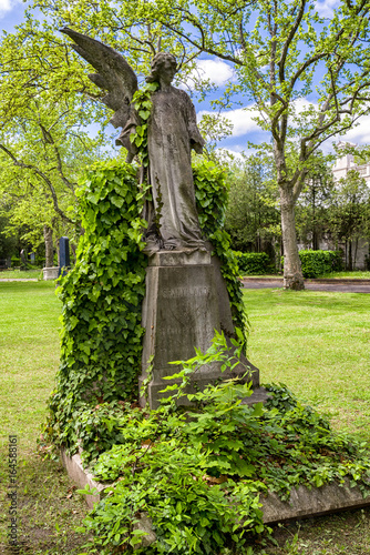 Angel with one wing in Kerepesi - historic cemetery in Budapest, Hungary photo