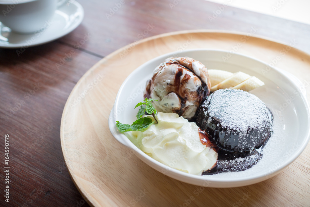 hot chocolate lava cake with vanilla ice cream ball, banana and whipped cream hot chocolate lava cake with vanilla ice cream ball, banana and whipped cream