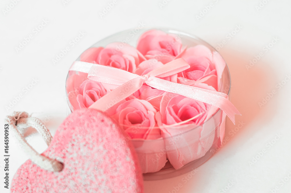 soap rose in gift box with bow and pumice in the shape of a heart on a white background soap rose in gift box with bow and pumice in the shape of a heart on a white background