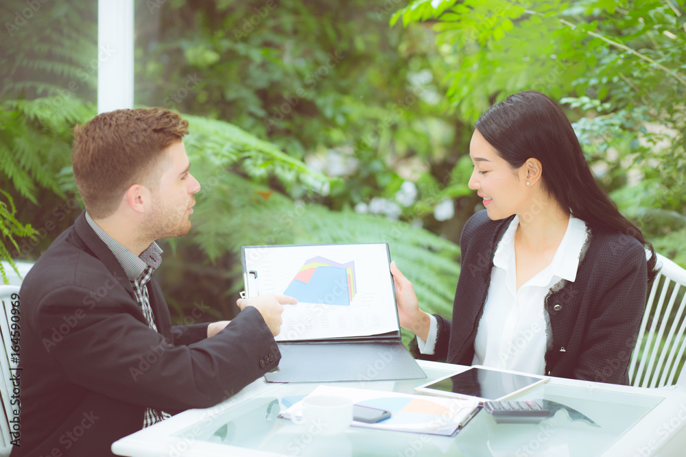 young business people making meeting and talking for analyzing marketing working at office on desk. young business people making meeting and talking for analyzing marketing working at office on desk.