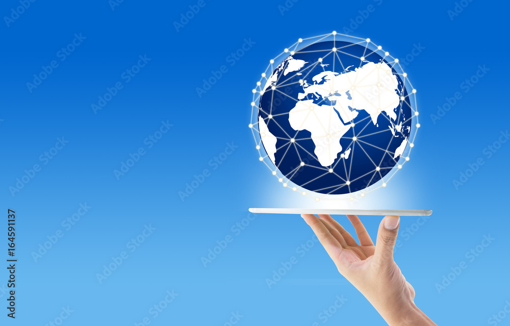 Businessman holding in hand tablet with global network communication connection concept, Elements of this image furnished by NASA. Businessman holding in hand tablet with global network communication connection concept, Elements of this image furnished by NASA.
