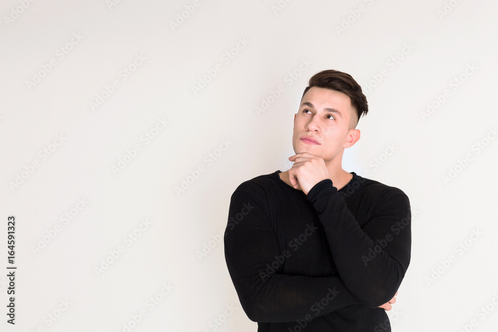 Pensive young man studio portrait, boy style Pensive young man studio portrait, boy style