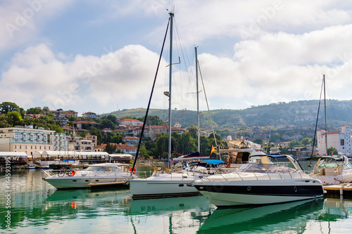 Yachts, sailing boats and pleasure boats are moored in marina of Balchik city in black sea coast at Bulgaria