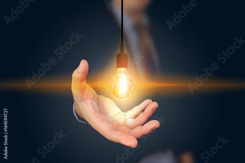 businessman holding light bulb. creative business strategy concept