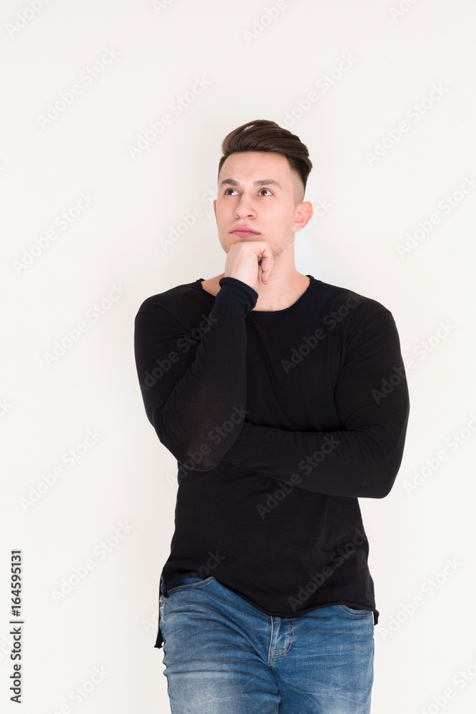 Pensive young man studio portrait, boy style Pensive young man studio portrait, boy style