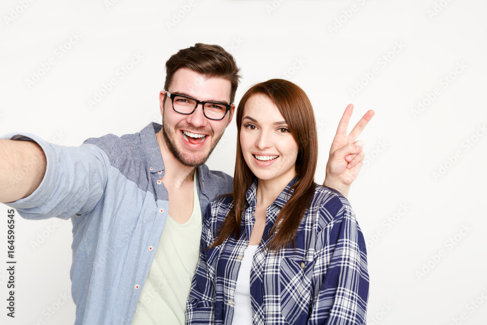 Couple taking selfie for social media, isolated Couple taking selfie for social media, isolated