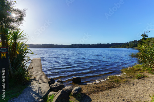 Beautiful Lake Ianthe or Matahi is West Coast's forest-lined fresh blue water lakes , popular for camping , boating, swimming, and trout fishing , South Island of New Zealand photo