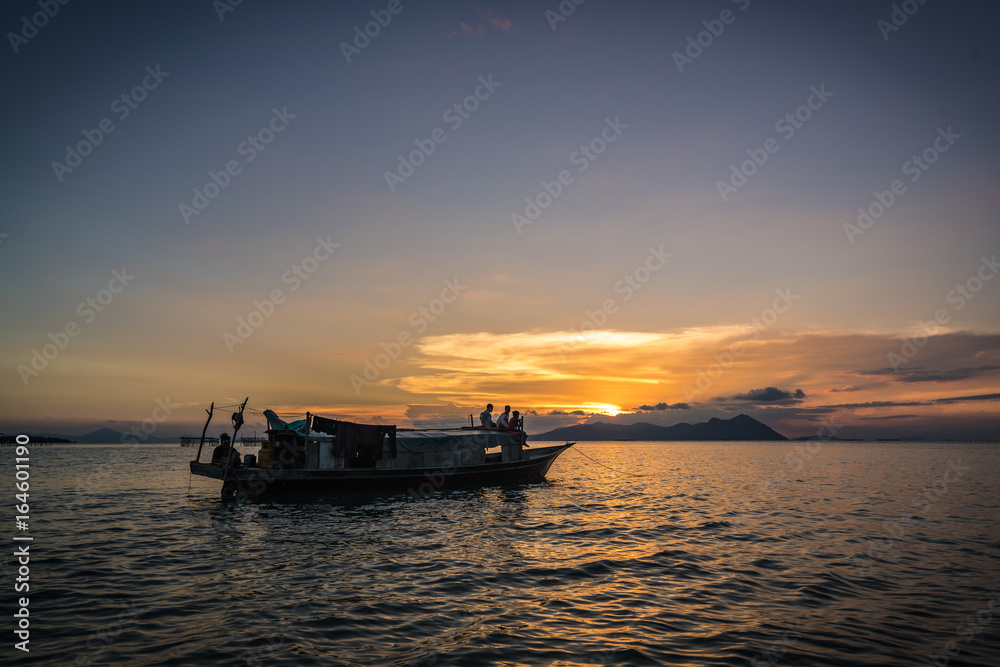 Bajau laut boat returning to the cummunity in Semporna, Sabah