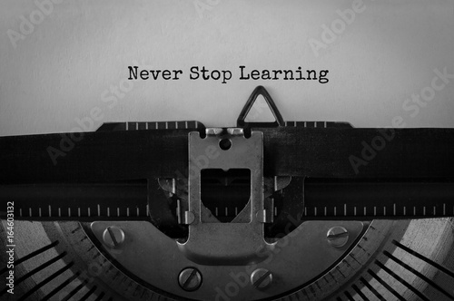 Photography Text Never Stop Learning typed on retro typewriter