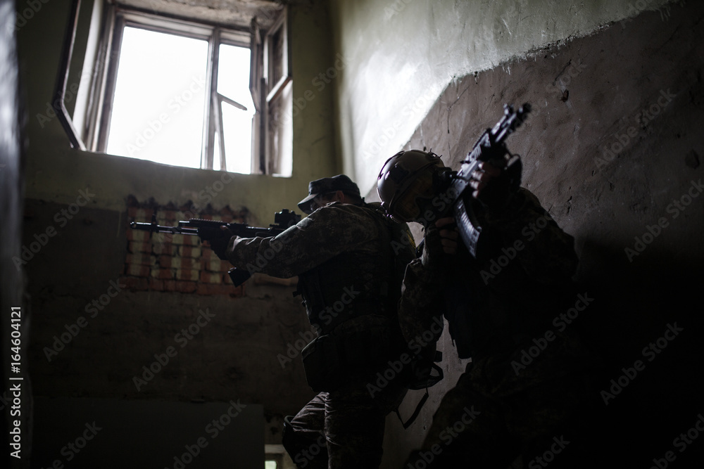 Fototapeta premium Photo of soldiers with weapons