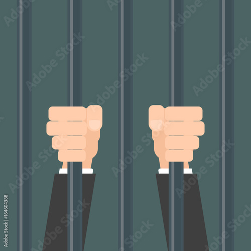 businessman hands behind bars