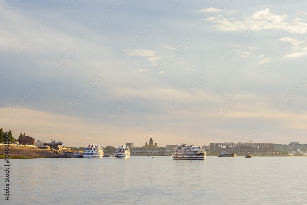 Motor ships go on a cruise along the Volga from the pier in Nizhny Novgorod